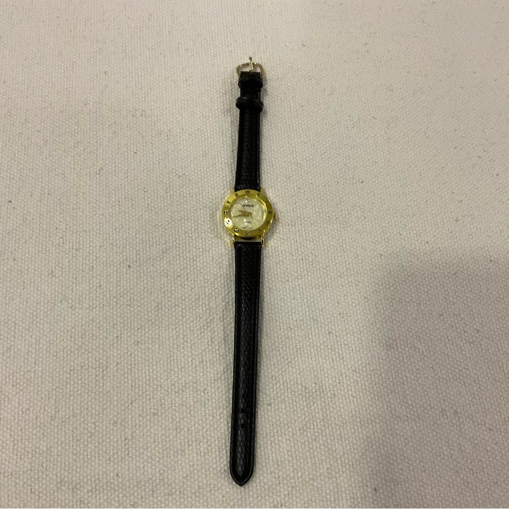 NWOT. Hanslin brand. Watch. White Pearl face. Gold hands and bezel. New battery.